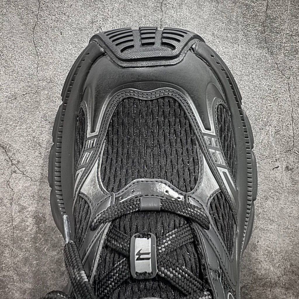 Balenciaga sneakers, top view with black knit collar and dark lace area