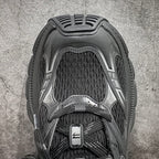 Balenciaga sneakers, top view with black knit collar and dark lace area