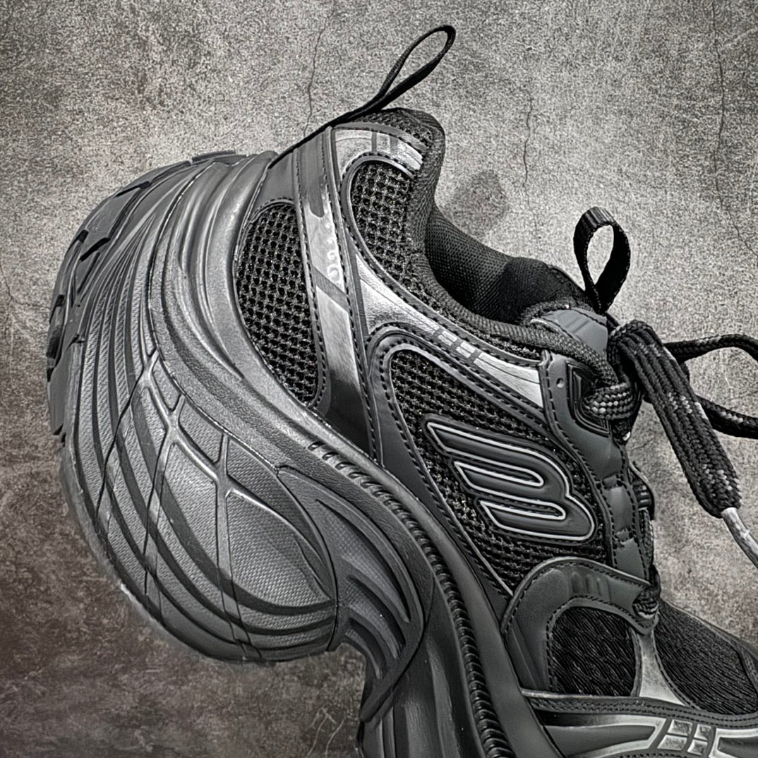 Balenciaga chunky sneakers side profile, black laces over dark mesh and silver panels