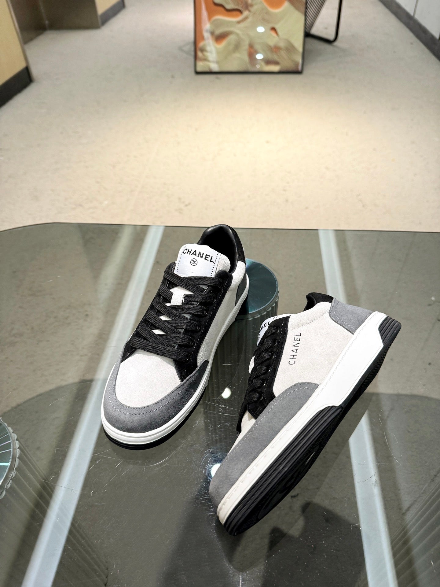 Chanel unisex lace-up sneakers, black-and-white upper with thick rubber sole