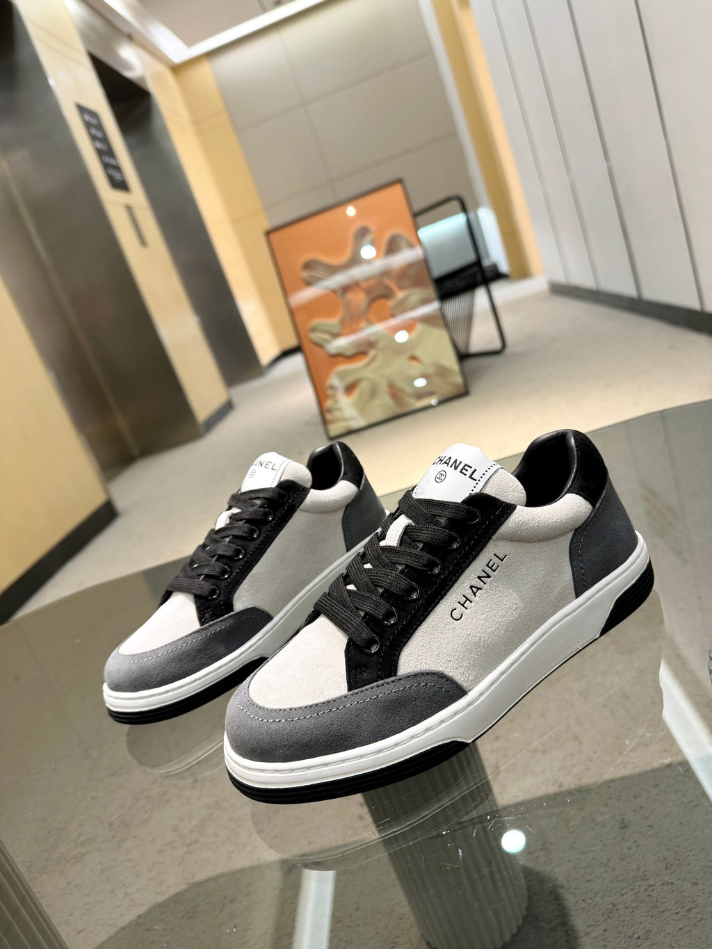 Chanel unisex lace-up sneakers, black suede panels with white toe and heel tabs