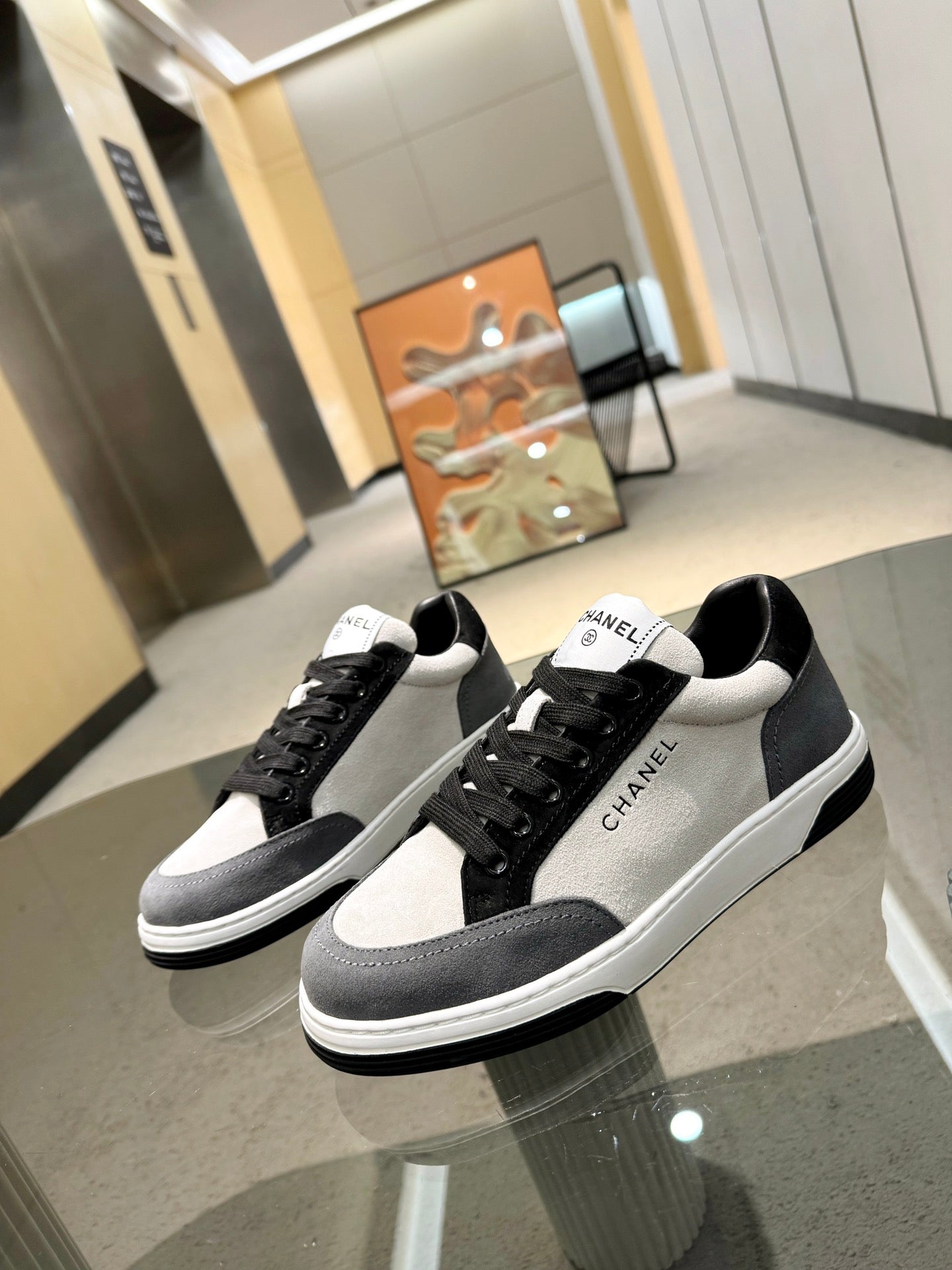 Chanel unisex lace-up sneakers, black suede panels with white toe and heel tabs