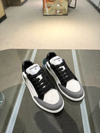 Chanel unisex low-top sneakers, black canvas uppers with white quarter and toe panels