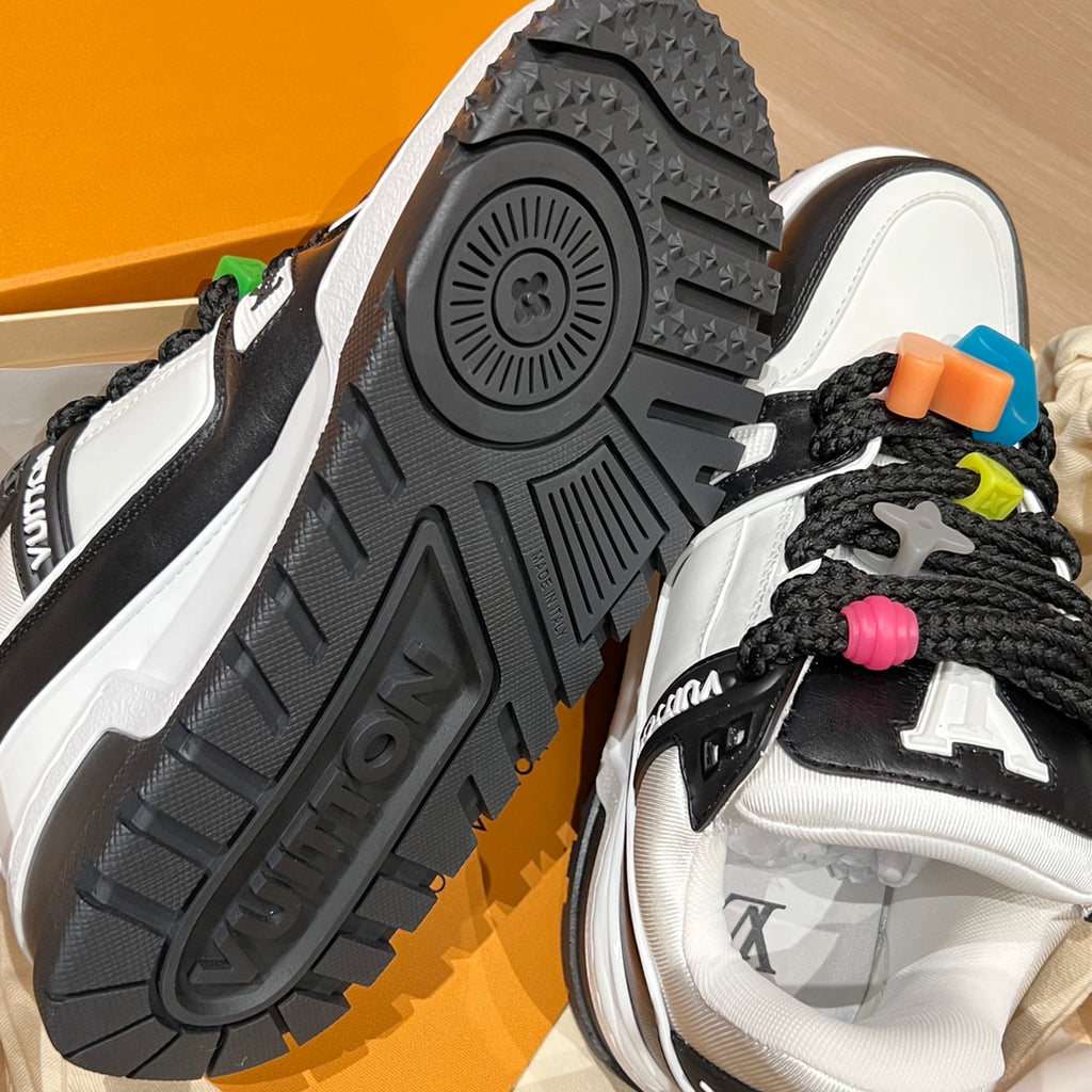Louis Vuitton trainer outsole view, textured black tread with white and black upper