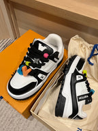 Louis Vuitton trainer sneakers pair, white leather with black trim and colorful charms