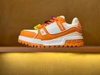 Orange/white Louis Vuitton trainer sneakers with multicolor lace charms and chunky sole