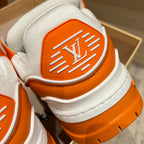 Louis Vuitton trainer heel with orange LV logo patch and textured white midsole