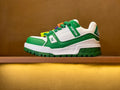 Green-and-white low-top sneakers with LV logo patch and colorful lace charms