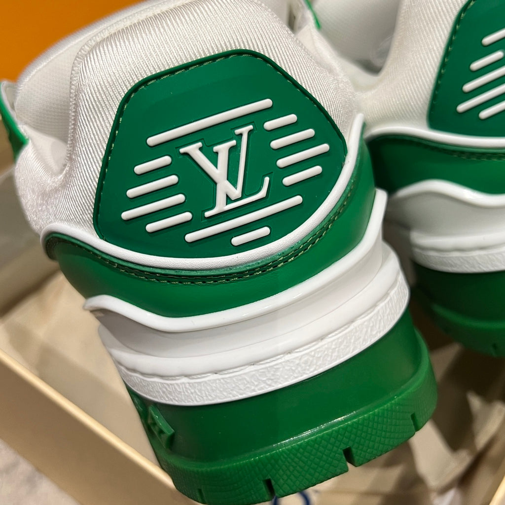 Green-and-white sneaker heel with LV monogram emblem and ribbed stripes