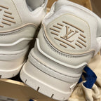 Louis Vuitton trainer shoe heel close-up, white outsole with Louis Vuitton logo detail
