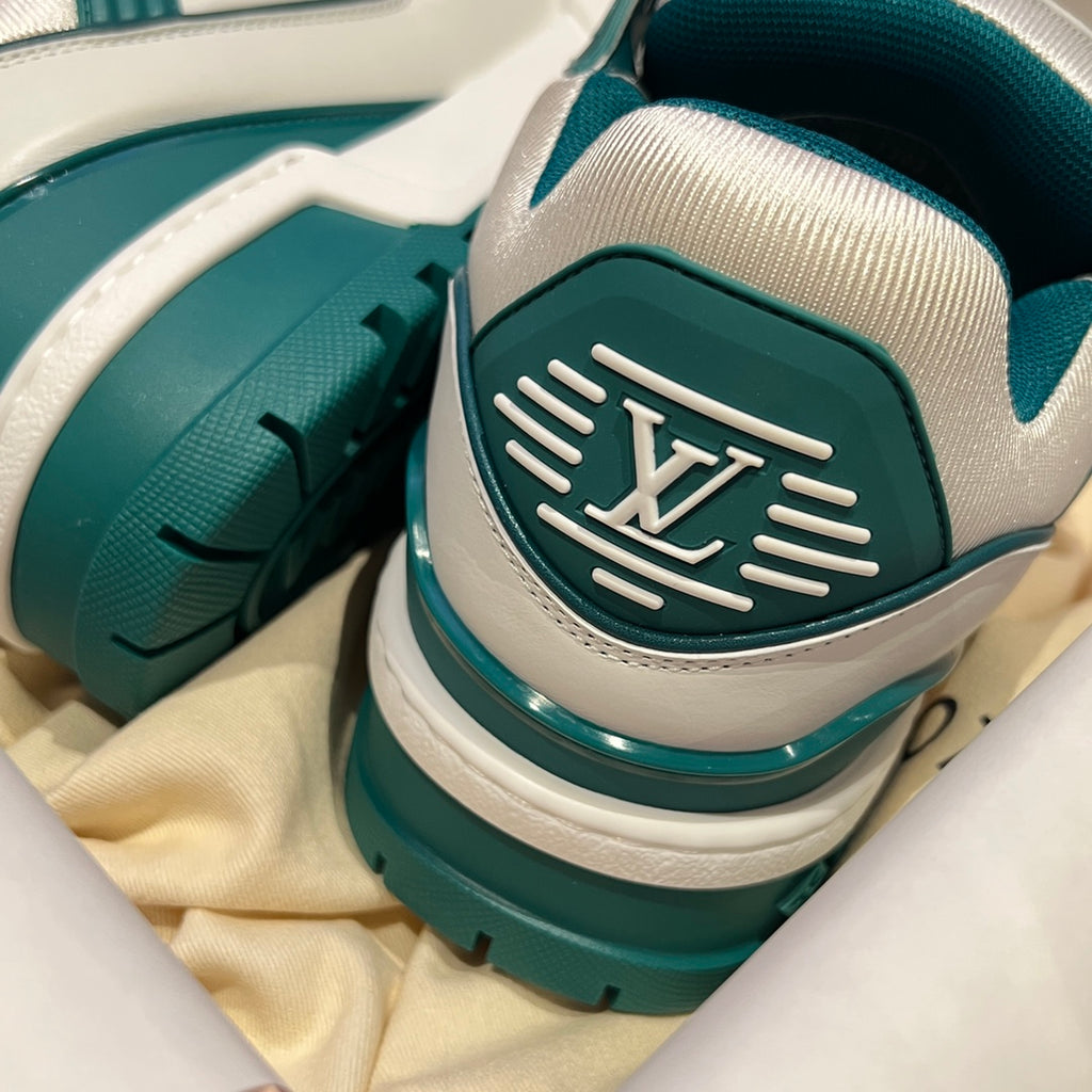 Louis Vuitton sneaker heel close-up, teal rubber sole and white upper
