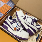 White and purple low-top sneakers in open box with purple lacing and logos