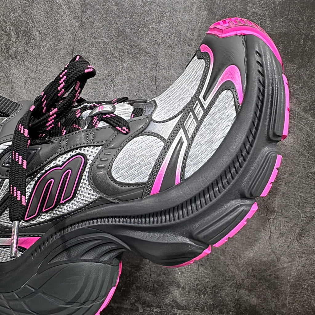 Balenciaga chunky sneaker, close side view; gray mesh upper, black sole, neon pink edge