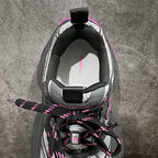 Balenciaga sneaker, interior heel view; black lining with laces and neon pink details