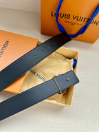 Dark blue leather belt with silver-tone buckle and rectangular keeper loop.