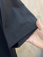 Black T-shirt hem with stitched edge detail