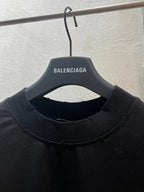 Black crewneck T-shirt neckline with BALENCIAGA logo on inner neck label