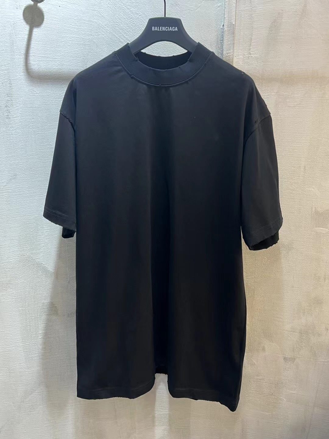 Black crewneck T-shirt with BALENCIAGA logo at back neck
