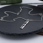 Silver-tone chain necklace with rectangular pendant and link detail
