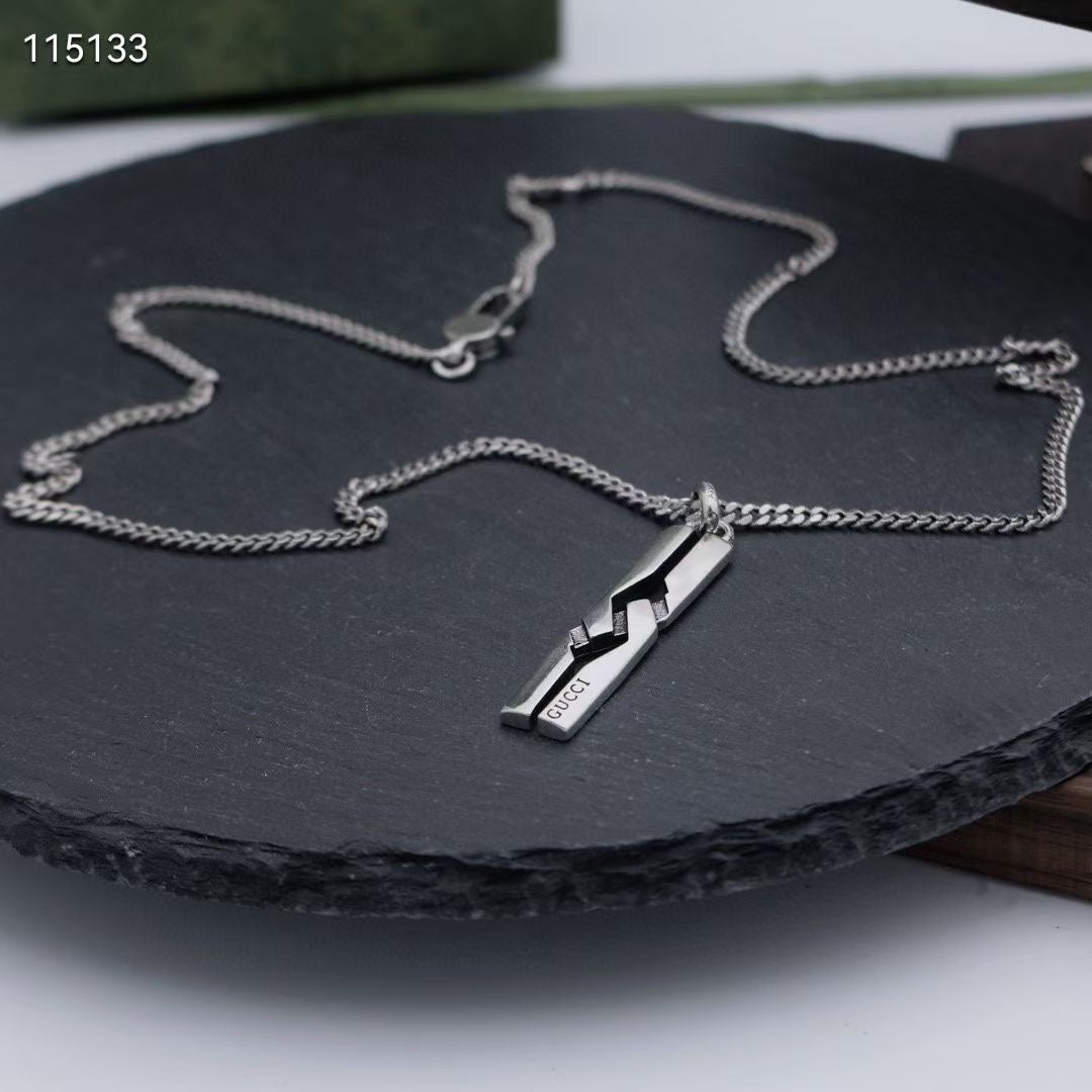 Silver-tone chain necklace with rectangular pendant and link detail