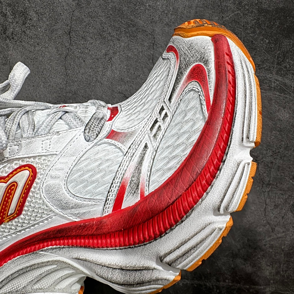 Balenciaga unisex sneakers, close-up of heel and side in white with red and orange