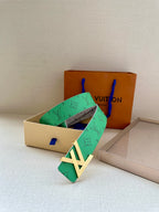 Green monogram belt with gold LV buckle and visible adjustment holes