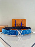 Blue monogram Louis Vuitton belt with gold-toned buckle on a display stand