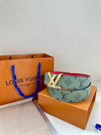 Green-gray monogram belt with red interior and gold-tone LV buckle