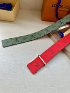 Green-gray monogram strap and red monogram belt with gold-tone buckle