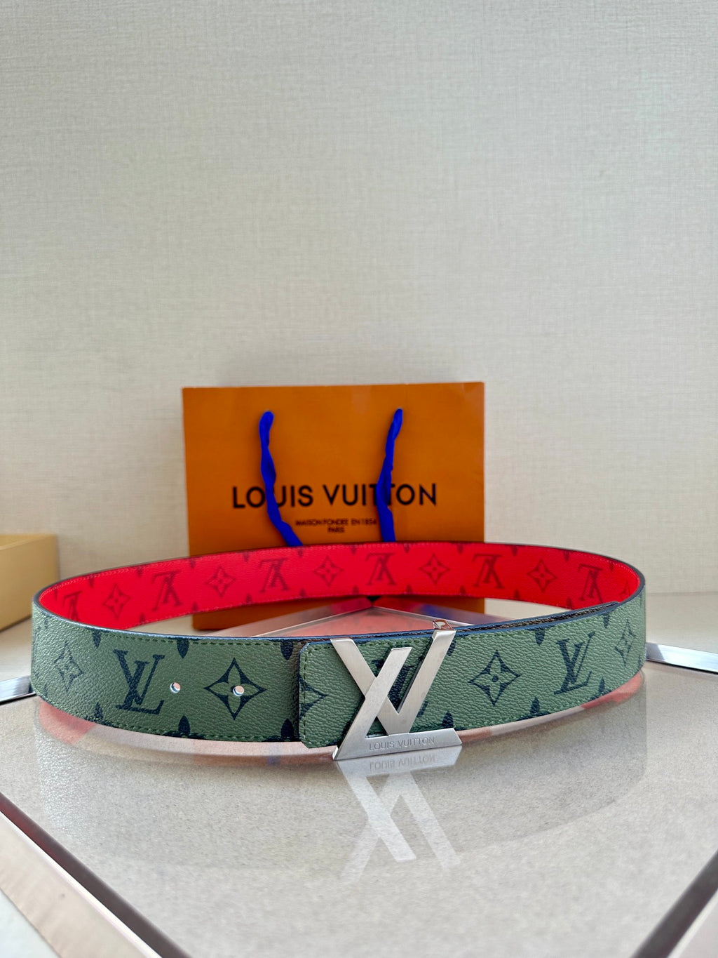 Logo monogram belt in green-gray with red lining and silver-toned buckle