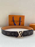 Louis Vuitton monogram belt with dark patterned strap and gold-tone buckle