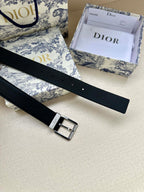 Dark navy leather belt with silver buckle and stitched edge