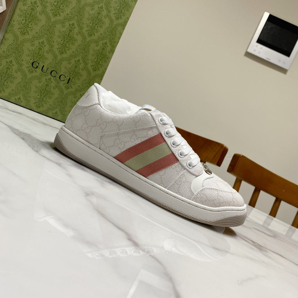 White Gucci unisex sneakers, side view with red green stripe and lace-up design