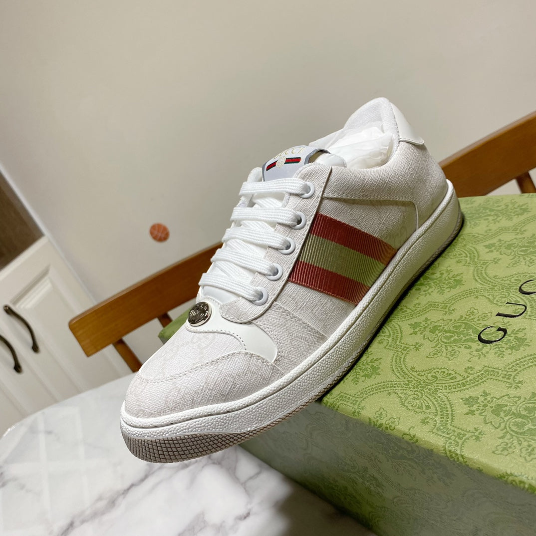 White Gucci unisex sneakers with red green web stripe and laced front
