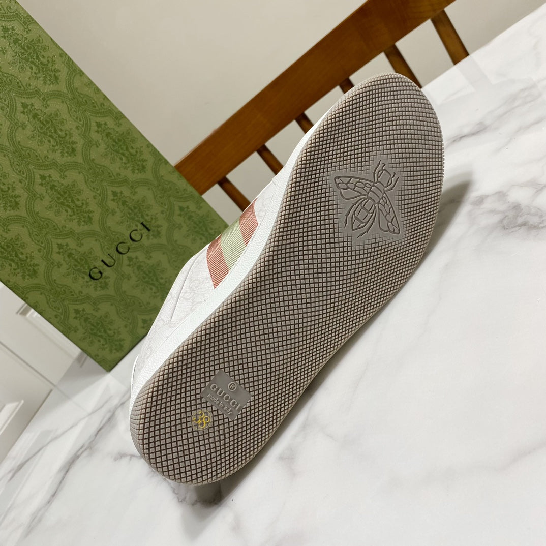 Gray Gucci unisex sneaker outsole with bee graphic and Gucci lettering