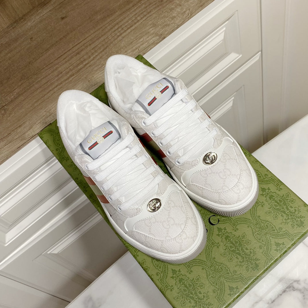 White Gucci unisex sneakers with woven pattern uppers and round metal logo details