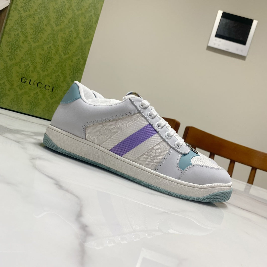 Gucci unisex low-top sneakers, white leather with purple panel and teal sole, laced.
