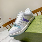Gucci unisex sneakers, white with purple stripe and light blue toe and heel, laced.