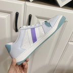 Gucci unisex sneakers, white upper with purple stripe and light blue outsole, laced.