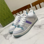 Gucci unisex sneakers in white with purple stripe and teal accents, lace-up.
