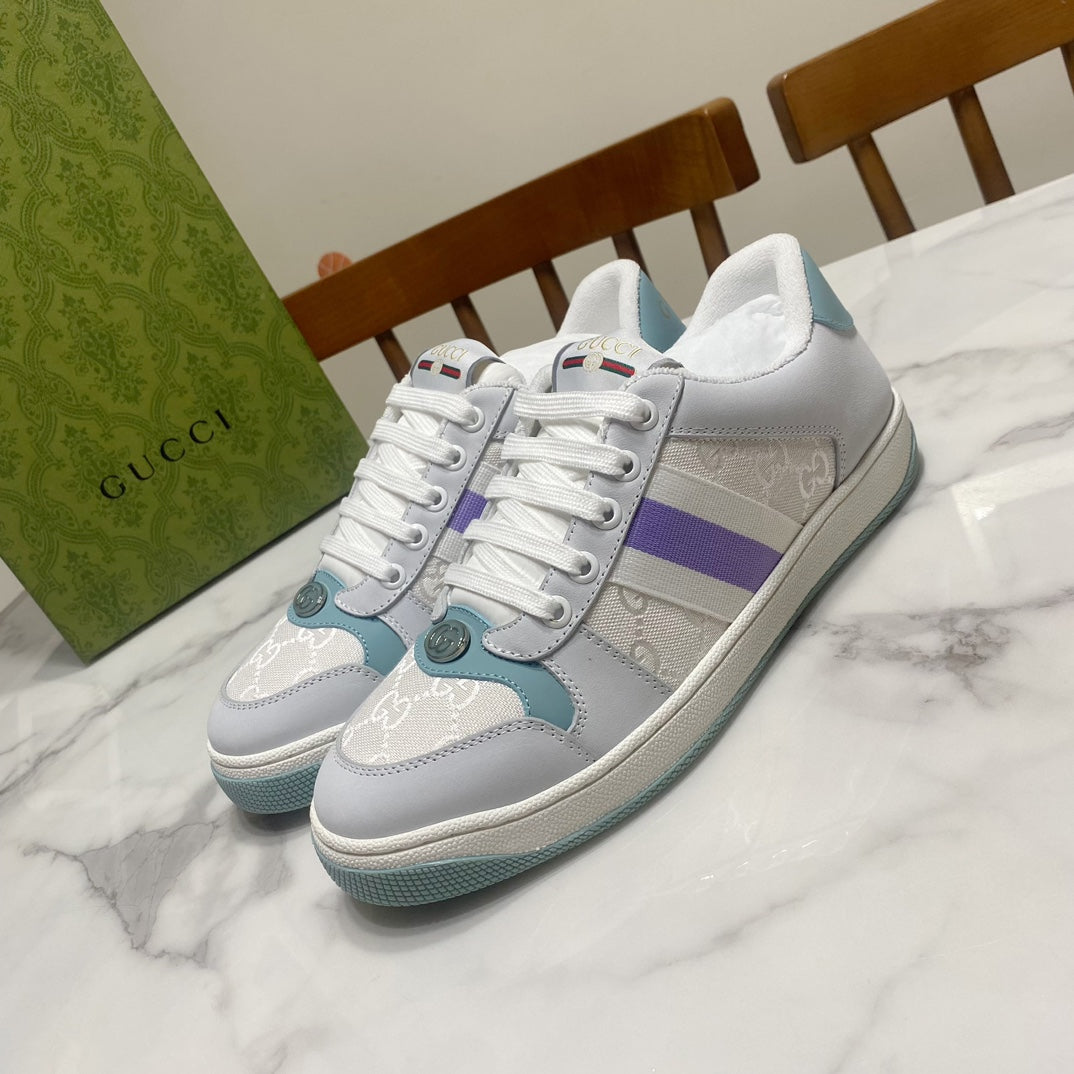 Gucci unisex sneakers in white with purple stripe and teal accents, lace-up.