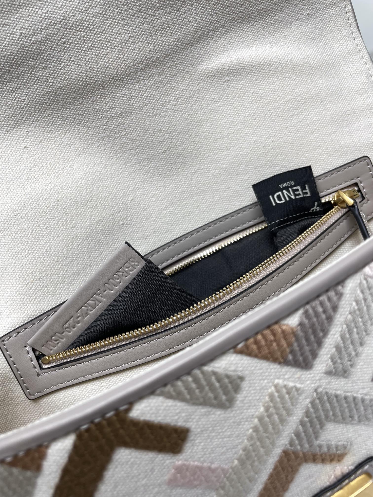 Fendi bag interior pocket with gold zipper and FENDI label
