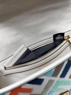 Fendi baguette bag interior zipper pocket with gold zipper and navy fabric lining