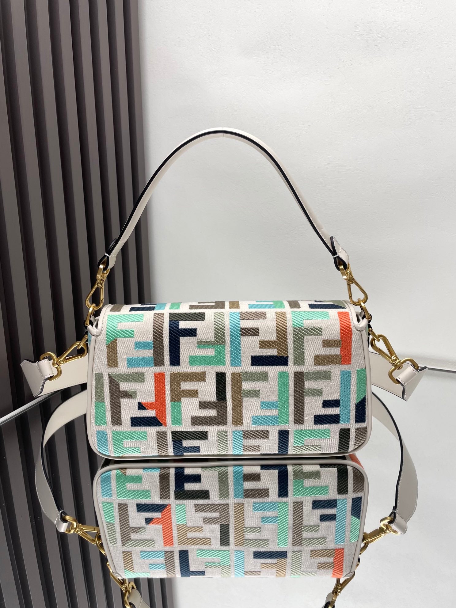 Fendi baguette bag front view, multicolor FF jacquard, gold hardware, shoulder strap