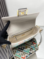 Fendi baguette bag open, beige interior and front pocket with gold zipper on FF lining