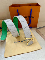 Louis Vuitton monogram belt in white and green with gold LV buckle, shown folded.