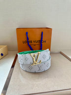 Louis Vuitton monogram belt in white with green lining and gold LV buckle, round view.