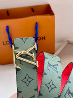 Louis Vuitton belt with mint monogram strap, red underside, and gold-tone buckle