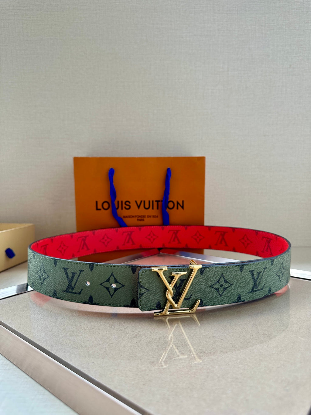 Louis Vuitton belt with mint green monogram strap and gold-tone buckle