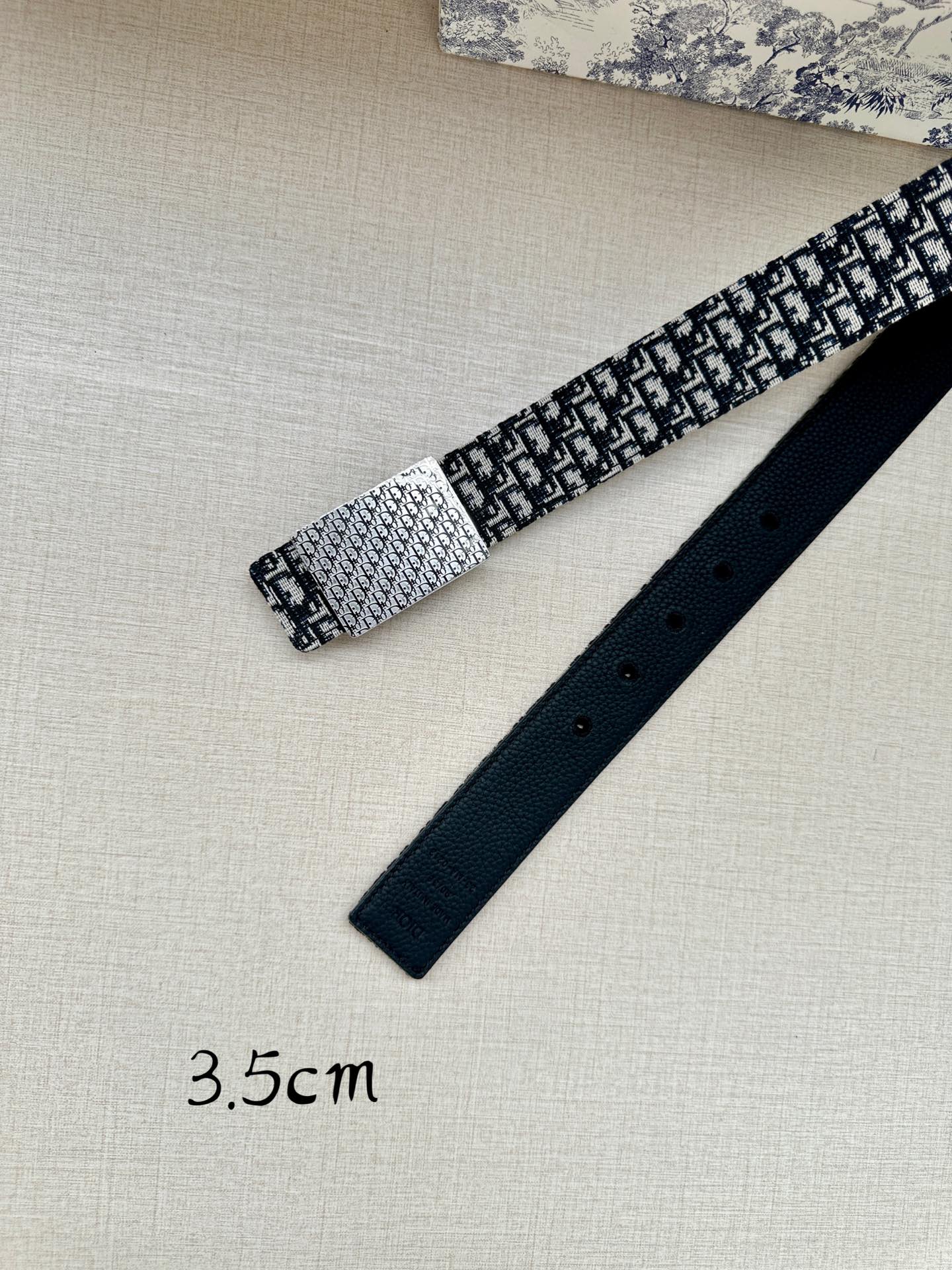 Dior belt accessory set with black and white patterned strap and separate dark leather strap